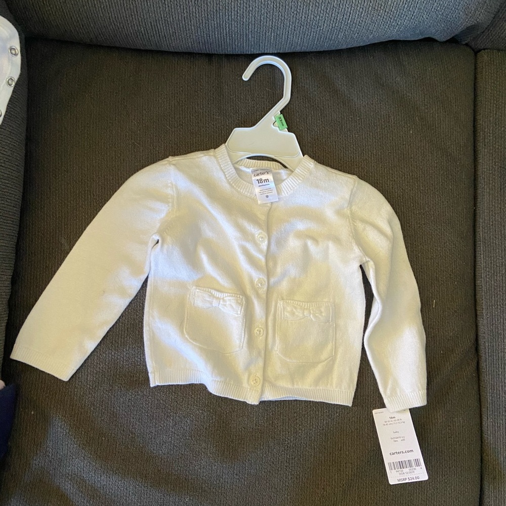 White button up sweater with two front pockets